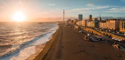 Magical sunset aerial view of British Airways i360 viewing tower pod with tourists in Brighton photo