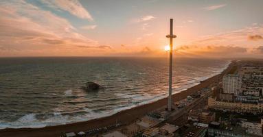 Magical sunset aerial view of British Airways i360 viewing tower pod with tourists in Brighton photo