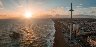 Magical sunset aerial view of British Airways i360 viewing tower pod with tourists in Brighton photo