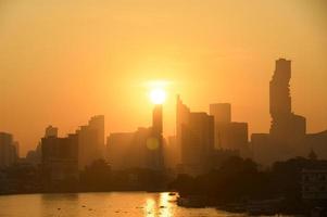 Bangkok Thailand sunrise skyline silhouette view withurban office buildings. photo