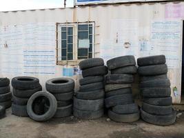 Pile of old tires near a gas station in Kyrgzystan photo