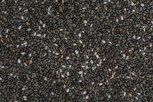 foto de fotograma completo de ángulo alto de granos de semillas de chía que forman un patrón para el fondo, papel tapiz