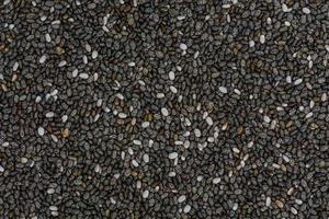 High angle full-frame photo of Chia seed grains making pattern for background, wallpaper