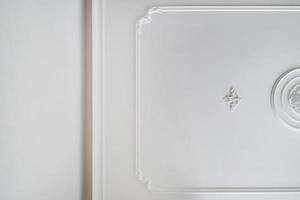 Detail of corner ceiling cornice with intricate crown molding. photo