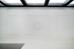 Detail of corner ceiling cornice with intricate crown molding. photo