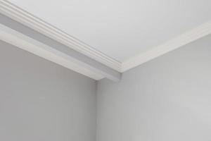 Detail of corner ceiling cornice with intricate crown molding. photo