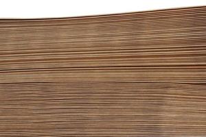 Stacked brown paper envelopes isolated on white background. photo