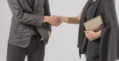 Two confident businessman shook hands during office meetings. photo