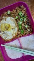 Lunch with fried noodles with beef eye eggs topped with green chili slices 03 photo