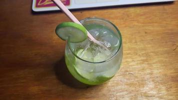 Refreshing Lemon squash drink on wooden table photo