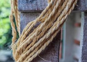 Old rope bound around an old vintage box in a close up. photo