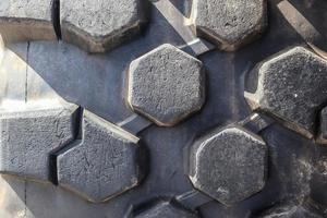 Close up view at almost new black tire treads photo