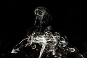 Smoke effect texture. Isolated background. Black and dark backdrop. Smokey fire and mistic effect. photo