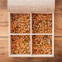 Container with cereals. Close-up of wooden box with cereals inside it photo