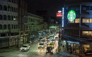 BANGKOK, THAILAND. 2018. - Starbucks Corporation is an American coffee company and coffeehouse chain, image of night photography at Yaowarat rd. branch, Bangkok. photo