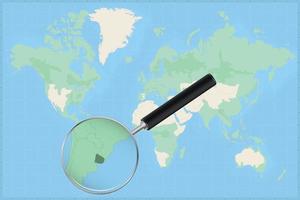 Map of the world with a magnifying glass on a map of Uruguay. vector