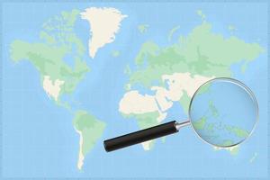 Map of the world with a magnifying glass on a map of Palau. vector