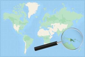 mapa del mundo con una lupa en un mapa de papúa nueva guinea. vector