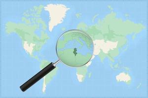 Map of the world with a magnifying glass on a map of Tunisia. vector