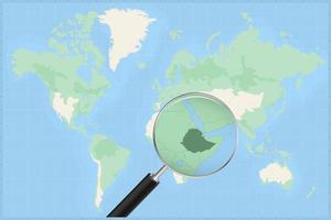 Map of the world with a magnifying glass on a map of Ethiopia. vector