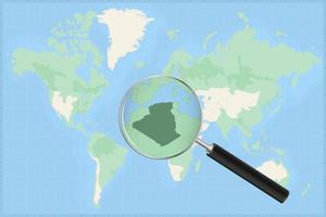 Map of the world with a magnifying glass on a map of Algeria. vector