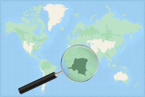 Map of the world with a magnifying glass on a map of DR Congo. vector