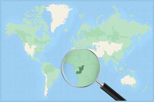 Map of the world with a magnifying glass on a map of Congo. vector