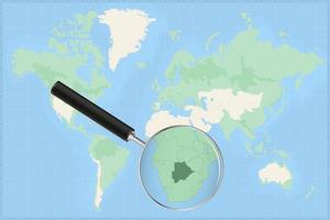 Map of the world with a magnifying glass on a map of Botswana. vector