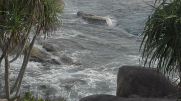 Turquoise waves rolled on the rocks, beach of Koh Miang island, Similan Islands, slow motion video