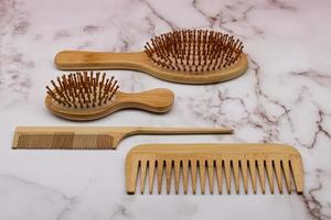 Hair brushes set isolated on marble background. photo