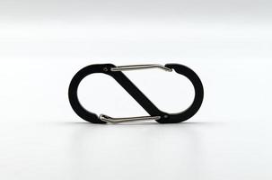 Black and silver carabiner isolated on white background photo
