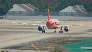 PHUKET, THAILAND DECEMBER 2, 2016 - AirAsia Airbus 320 HS BBS taxiing after landing. View from the top floor of the hotel Centara Grand West Sands Resort Phuket video