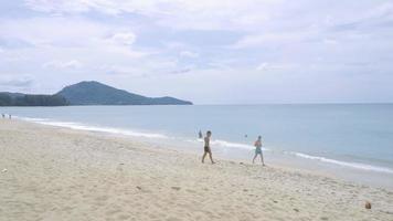 PHUKET, THAILAND NOVEMBER 28, 2017 Tourists walking near runway of Phuket International airport, Mai Khao beach, Phuket video