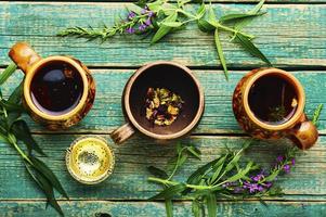 fireweed tea,rustic wooden table photo