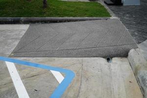 Building entrance trail with ramp for old or cannot self help disability person on wheelchair. photo