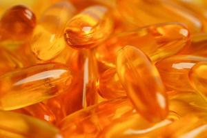 Fish oil or Cod liver oil gel in capsules with omega 3 vitamins, supplementary healthy food photo