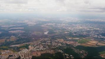 View from the window of the plane on the city of Moscow during landing or takeoff