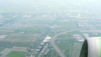 Passenger plane taking off over the city and climbing, first person view. Tourism and travel concept video