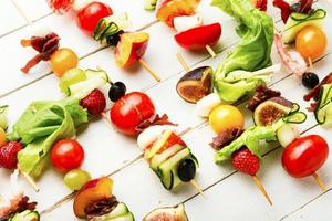 Easy snack from vegetables, fruits, meat and seafood photo