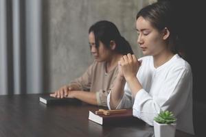 Christian life crisis prayer to god. Woman Pray for god blessing to wishing have a better life. woman hands praying to god with the bible photo