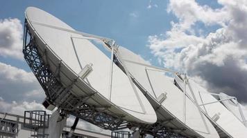 clouds flying over a parabolic antenna video