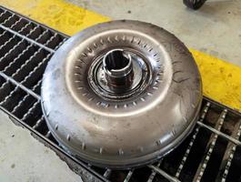 torque converter assy on an automatic transmission or automatic transaxle being repaired at an auto repair shop photo