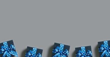 Banner with Black gift boxes with bow flat lay on grey background. View from above. Copy space photo