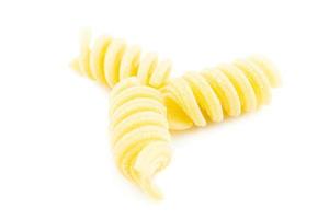 Fusilli on white background photo