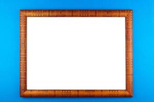 Wooden frame blue background photo