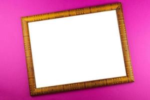 Wooden frame pink background photo