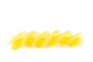 Fusilli on white background photo