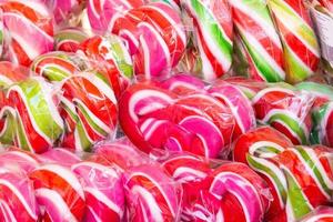 background of caramel lollipops photo
