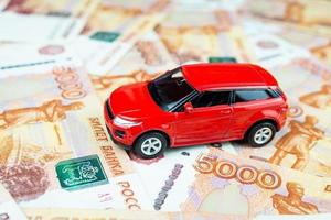 Toy car on money photo