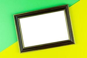 Wooden frame yellow background photo